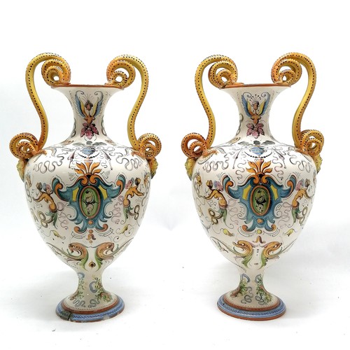 236 - Pair of large Italian Majolica vases with serpent scroll detail handles and profusely hand decorated... 
