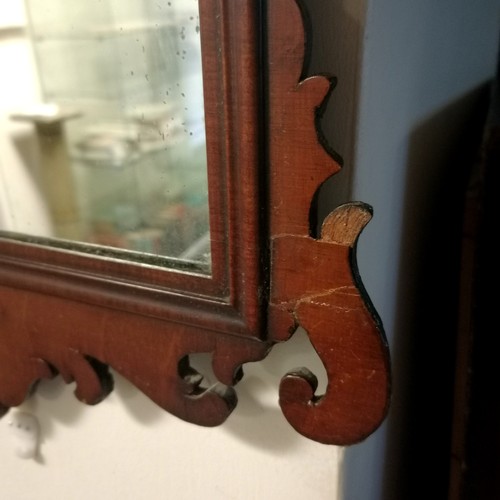 239 - Georgian mahogany framed mirror 57cm x37cm - has an old repair and a small loss to 1 scroll