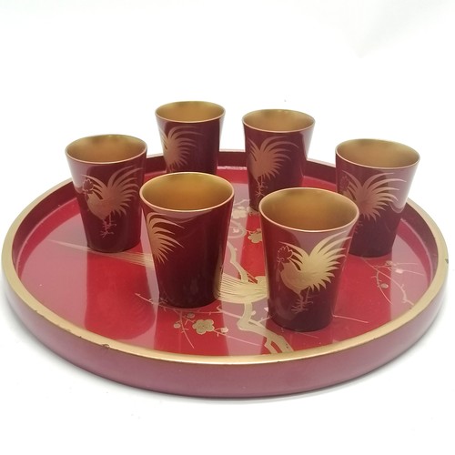 15 - Oriental red lacquer circular tray (27.5cm) with set of 6 matching beakers depicting asian bird deta... 