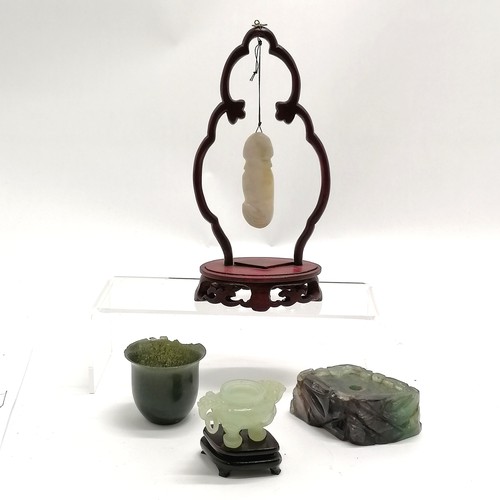 25 - Hardstone carved jade phallus suspended on a stand - 19cm high t/w antique jade cup (a/f) etc