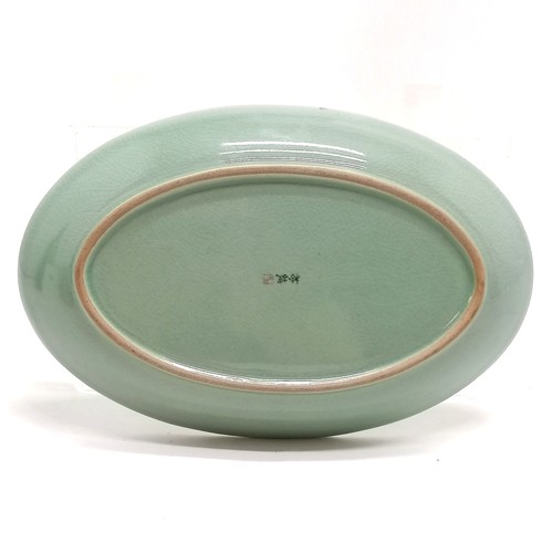 40 - Korean celadon crackle glaze floral oval dish with red / black 3 character mark to base - 26cm acros... 