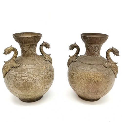 46 - Indian pair of brass 2 handled vases - 21cm high with engraved detail of dancers to the bodies