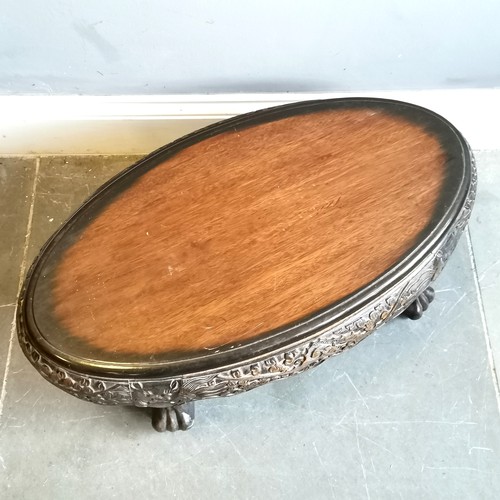 47 - Oriental hand carved oval coffee table on 4 claw feet - 80cm x 44cm x 31cm high ~ in used condition