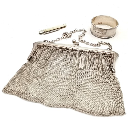 849 - 1924 silver mesh purse by AM&M Ld (13cm x 13cm and slight a/f) t/w silver napkin ring & silver blade... 