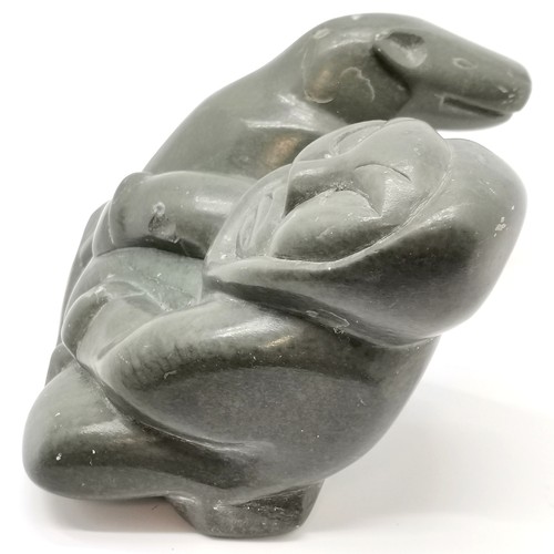 79 - Original Inuit argillite stone carving of an eskimo and bear with label & signed on base (Belcher Is... 