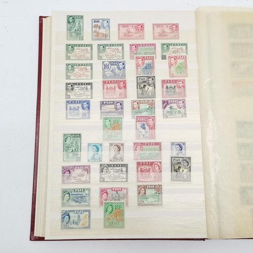 94 - Commonwealth mostly M/M (MH) useful stamp collection in red stockbook inc KGVI & early QEII sets inc... 