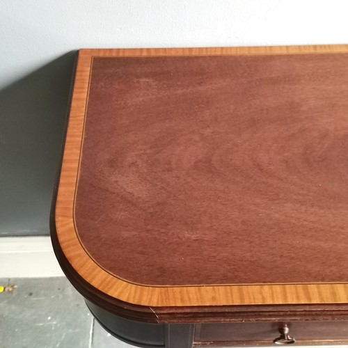 103 - Reproduction mahogany fold over card table with inlaid & marquetry drawer terminating on 4 brass cas... 