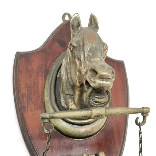 109 - Shield shaped wall mounted brass horses head with hanging gong, 60cm length x 24cm wide, good used c... 