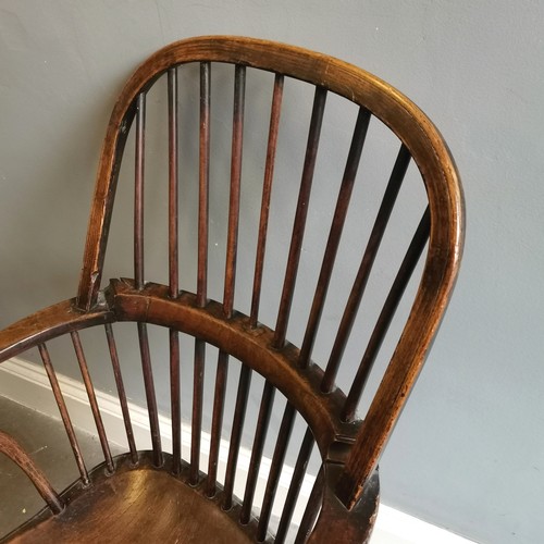 117 - Antique Windsor Elm bow back carver chair, 57cm wide x 42cm deep x 105cm high, split to seat and has... 