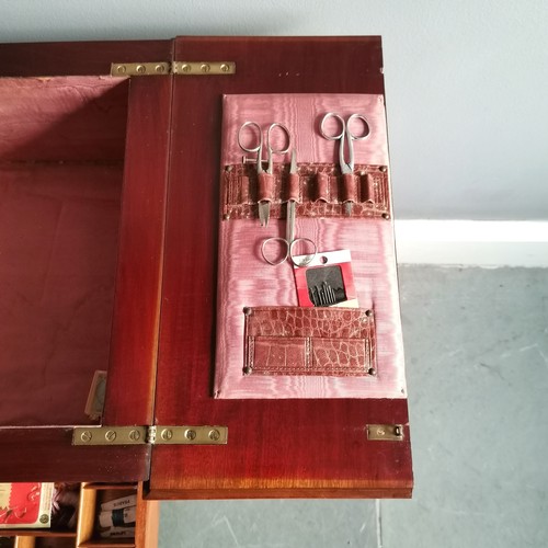 135 - Edwardian mahogany sewing cabinet with original pink silk lining, sprung drawer & double hinged lid ... 