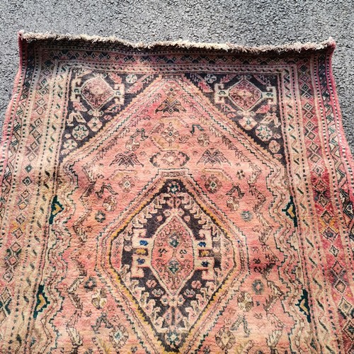 175 - Pink wool grounded rug ~ 172cm x 118cm - no obvious signs of damage, slight creasings