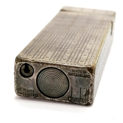 231 - Dunhill silver plated lighter with engine turned detail - 6.5cm long & has obvious signs of use