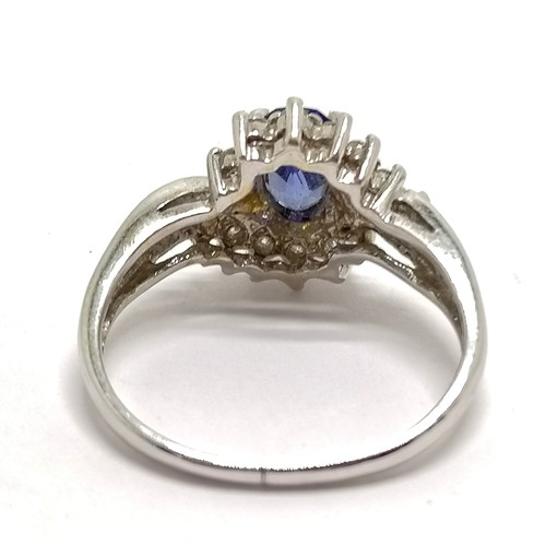 403 - 18ct hallmarked white gold sapphire & diamond (0.23cts total weight indicated) cluster ring - size M... 