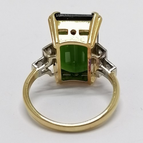 500 - 18ct marked gold large green tourmaline (approx 16mm long) & diamond ring - size N & 7.4g total weig... 