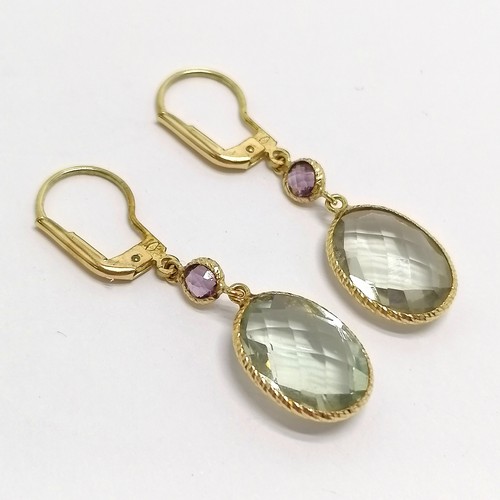 523 - 9ct marked gold earrings set with pale blue stone (aquamarine?) - 4cm drop & 3.7g total weight