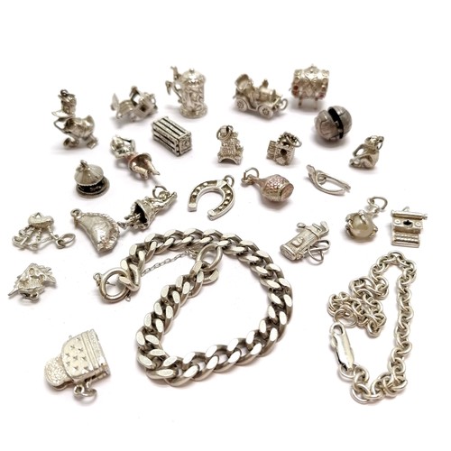 594 - Qty of silver charms + 2 bracelets inc donald duck playing saxophone, toaster, Nuvo church + barrel ... 