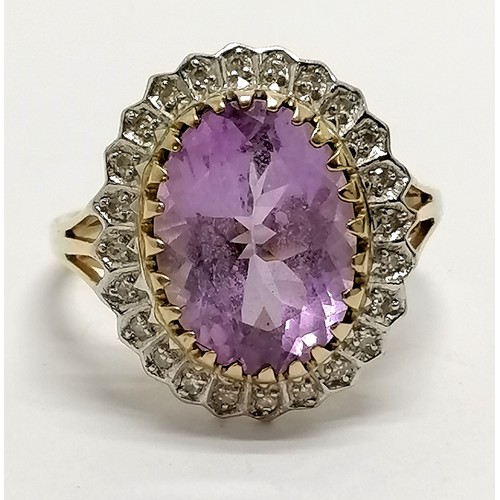 621 - 9ct hallmarked gold amethyst & diamond cluster ring - size U & 4.8g total weight