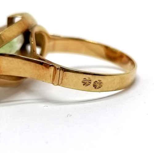 631 - Foreign marked gold (touch tests as 18ct) ring set with green stone - size N½ & 4.7g total weight