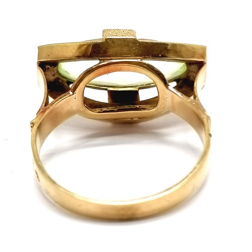 631 - Foreign marked gold (touch tests as 18ct) ring set with green stone - size N½ & 4.7g total weight