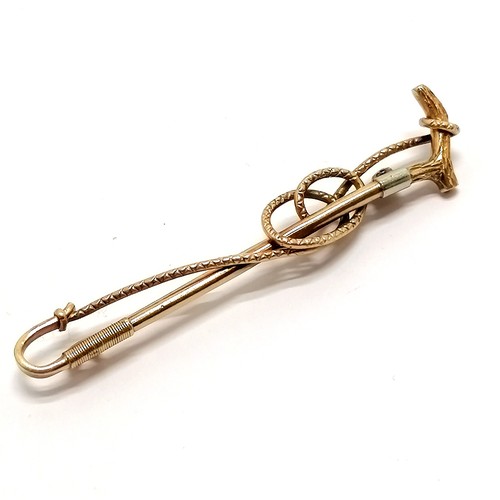 671 - 9ct hallmarked gold bar brooch in the form of a riding crop / whip with white metal detail - 6cm & 4... 