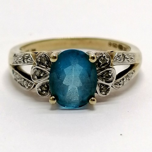 696 - 9ct hallmarked gold diamond & blue stone set ring - size R & 4.1g total weight