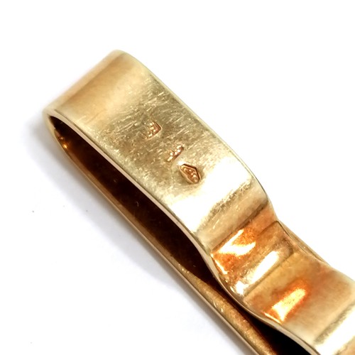 720 - Continental 18ct gold marked tieslide - 5.7cm long & 7.7g etc