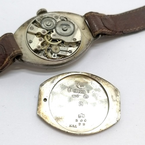 736 - Silver cased oval vintage manual wind wristwatch length of case 3.4cm long - runs but stops