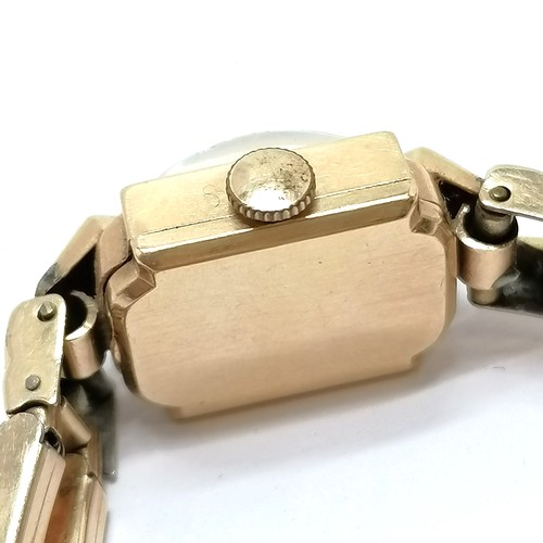 765 - 14ct gold cased Marvin Art Deco manual wind wristwatch (14mm across) on a non-gold stretchy bracelet... 