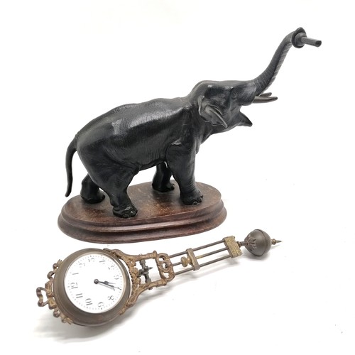 768 - Antique French bronze Elephant pendulum clock on a wooden base 28cm high - the pendulum is bent and ... 