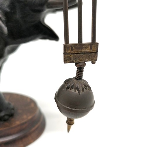 768 - Antique French bronze Elephant pendulum clock on a wooden base 28cm high - the pendulum is bent and ... 