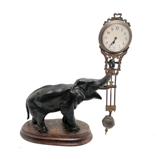 768 - Antique French bronze Elephant pendulum clock on a wooden base 28cm high - the pendulum is bent and ... 