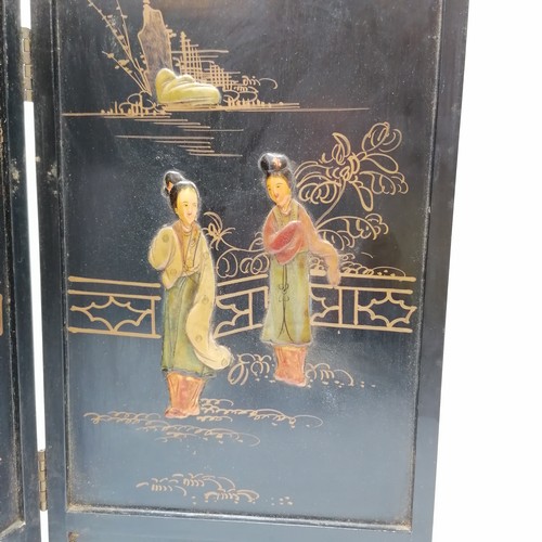 25 - Oriental 4 panel wooden table screen with figural raised relief detail - 93cm total length x 40.5cm ... 