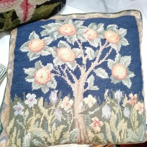 32 - Collection of seven assorted tapestry cushions, to include floral and animal patterns, 42 cm square.