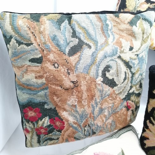 32 - Collection of seven assorted tapestry cushions, to include floral and animal patterns, 42 cm square.