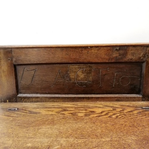 40 - Antique oak hall seat dated and initialled 1710 ACT, possibly made from a coffer, 74 cm wide x 37 cm... 