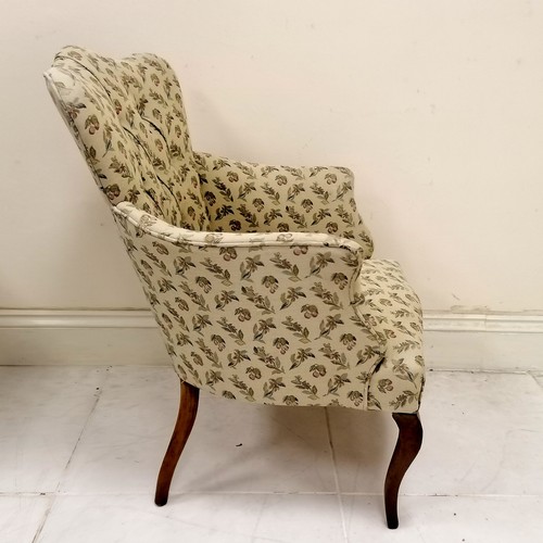 49 - Ladies cream and patterned button back upholstered armchair on slender cabriole legs,  in good condi... 