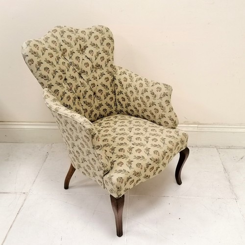 49 - Ladies cream and patterned button back upholstered armchair on slender cabriole legs,  in good condi... 