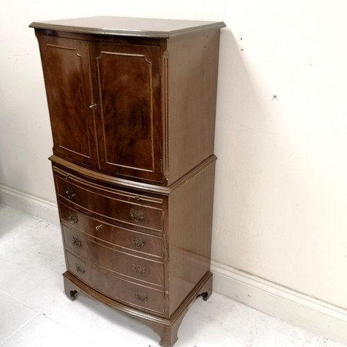 50 - Mahogany reproduction chest on chest, top having 2 door cupboard, base fitted with slide and 1 short... 