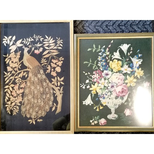 62 - Framed needlepoint of a peacock, 46 cm wide x 69 cm high, to include frame, and a floral display nee... 