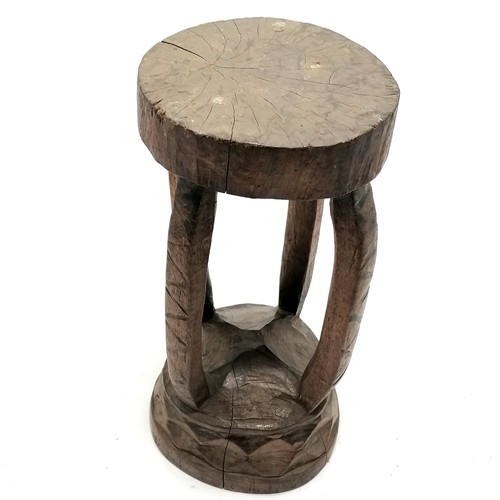 101 - Tribal carved wooden stool43cm x 23cm - has loss to the top detail - some stress cracks