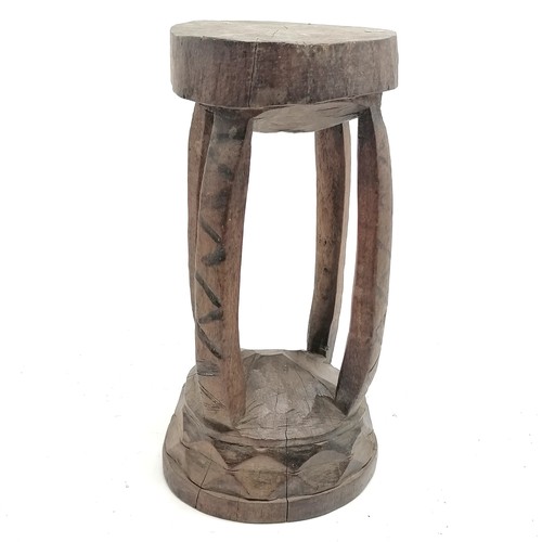 101 - Tribal carved wooden stool43cm x 23cm - has loss to the top detail - some stress cracks