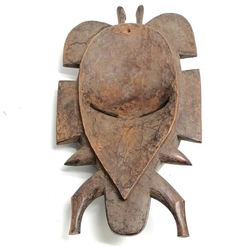 102 - Tribal carved wooden mask 43cm x 23cm - has loss to the top detail