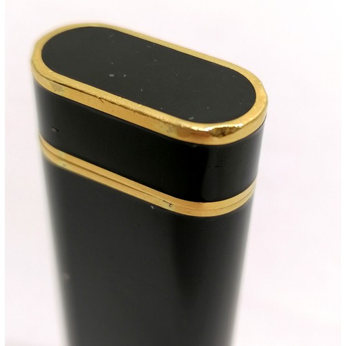 113 - Cartier Plaque Or G black enamel cigarette lighter - 7.1cm long & is in used condition