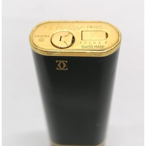 113 - Cartier Plaque Or G black enamel cigarette lighter - 7.1cm long & is in used condition