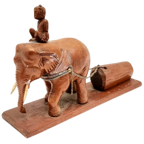 129 - Hand carved teak hinged lidded box depicting elephant dragging log t/w carved model of elephant drag... 