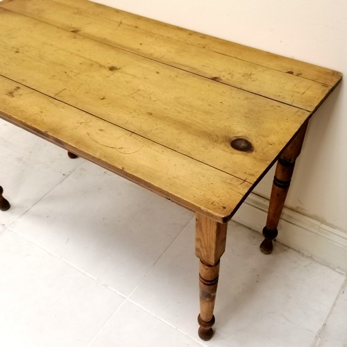 159 - Antique Rustic pine table, on turned legs, in used condition, 120 cm wide x 62 cm deep x 76 cm high.