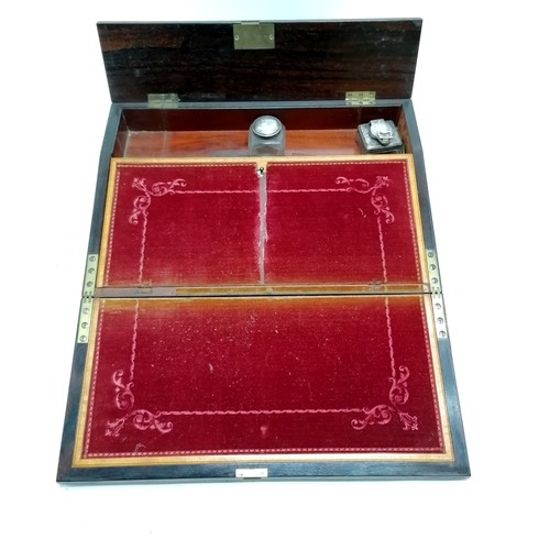 186 - Antique rosewood veneered writing slope with profuse mother of pearl decoration to top & has origina... 