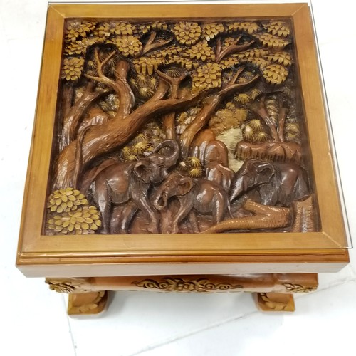 190 - Indian heavily carved teak carver chair, decorated with elephants walking through a forest, 67 cm wi... 