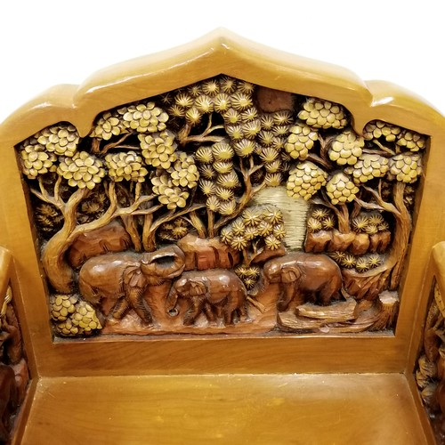 190 - Indian heavily carved teak carver chair, decorated with elephants walking through a forest, 67 cm wi... 