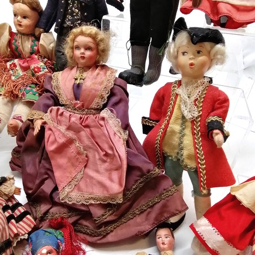 217 - A vintage collection of 18 costume dolls the talest 36cm high including Nistis Spanish doll, Peggy N... 